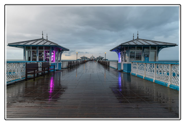 There are many #smallbusinessowners who operate #shops on #Llandudno #pier @PierLlandudno in #NorthWales. A #storm has emptied the pier reducing #customer numbers, however the #rain highlights the #reflections. #Cymru #landscape #photography #StormHour #Wales #SmallBusiness
