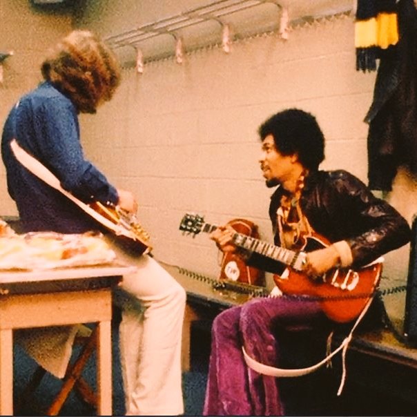 Mick Taylor and Jimi Hendrix backstage at Madison Square Garden, in 1969. Photo by ©Ethan Russell