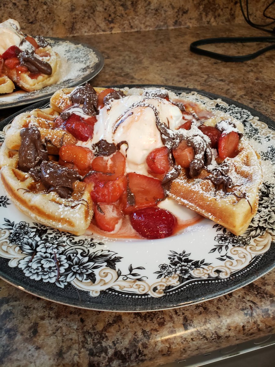 Fresh Belgium waffles, homemade strawberry maple syrup (with strawberry chunks), fresh maple whipped cream, dark chocolate drizzle, and sprinkled powdered sugar. Mother's Day breakfast was a success 😋