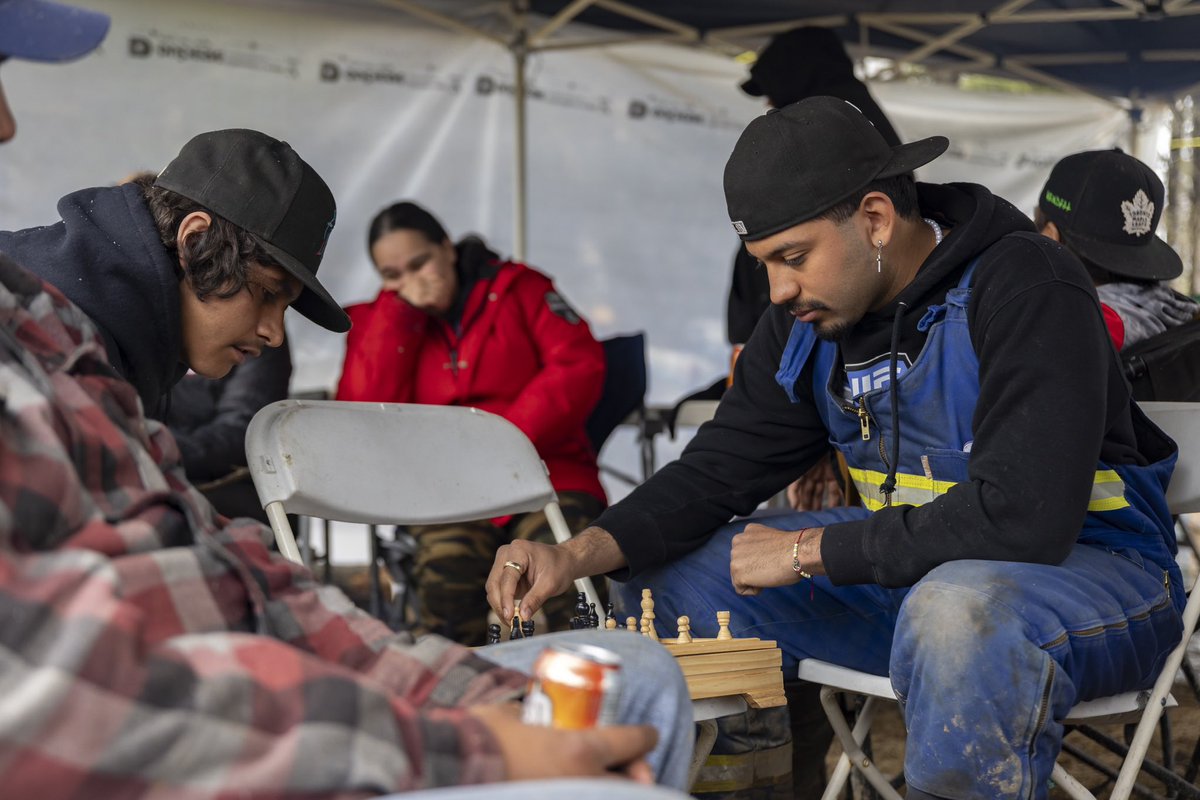 Passing the time during the rain snow at the Woodland Cree Traditional Camp on Friday May 17/24 Councillor Frank Whitehead holding court teaching the younger generation how to properly tie snares. 
#WCFN #IndigenousRights #Obsidian #OilandGas