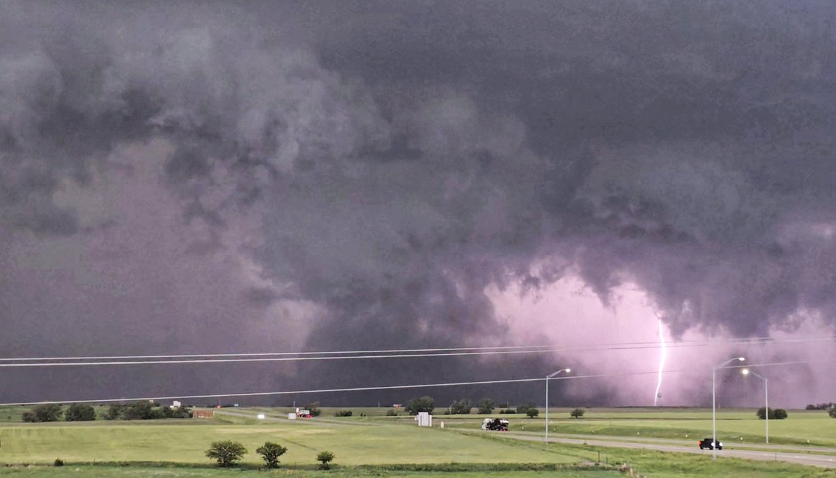 Video grab of the tornado and cg west of Wilson, KS this afternoon at 4:09pm Hoping everyone is ok and this was in a field. 🤞 #kswx We watched this spin up and dissipate from the I-70/ overpass to Wilson. Powerlines for perspective! ;)