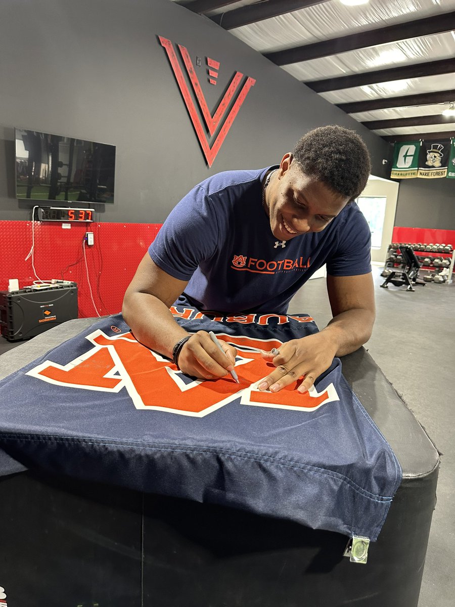 ❤️ the culture we are building with our Athletes. Proud to celebrate @EdwinFave 's signing w/ @AuburnFootball to continue his football journey - Signing of the flag in the #WarRoom is my favorite tradition we have built! Who’s Next? @Velocity_LS @RecruitGeorgia @KingNick66