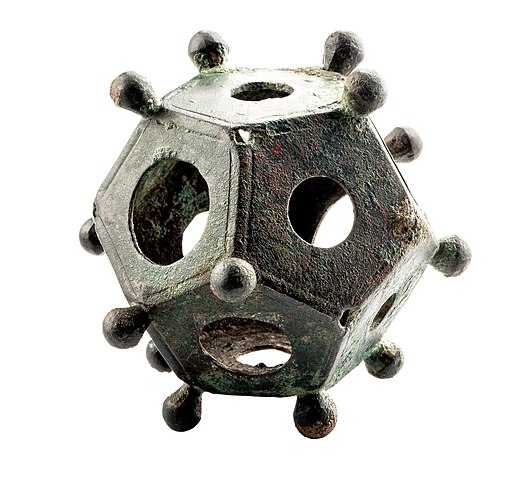 Roman Dodecahedron

The Roman dodecahedron is a small, hollow object made of bronze or, more rarely, stone, with a geometrical shape that has 12 flat faces. Each face is a pentagon, a five-sided shape. The Roman dodecahedra are also embellished with a series of knobs on each
