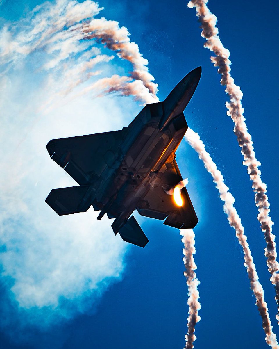 An F-22 Raptor, flown by Capt. Samuel Larson, F-22 Raptor Demo Team pilot, deploys flares over the Gulf of Mexico during the 2024 Gulf Coast Salute Air Show at Panama City Beach on May 4, 2024. (alvarez)