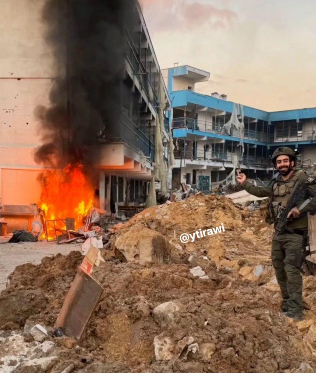 ISRAELI SOLDIER POSTED A PICTURE OF HIMSELF BURNING DOWN A SCHOOL