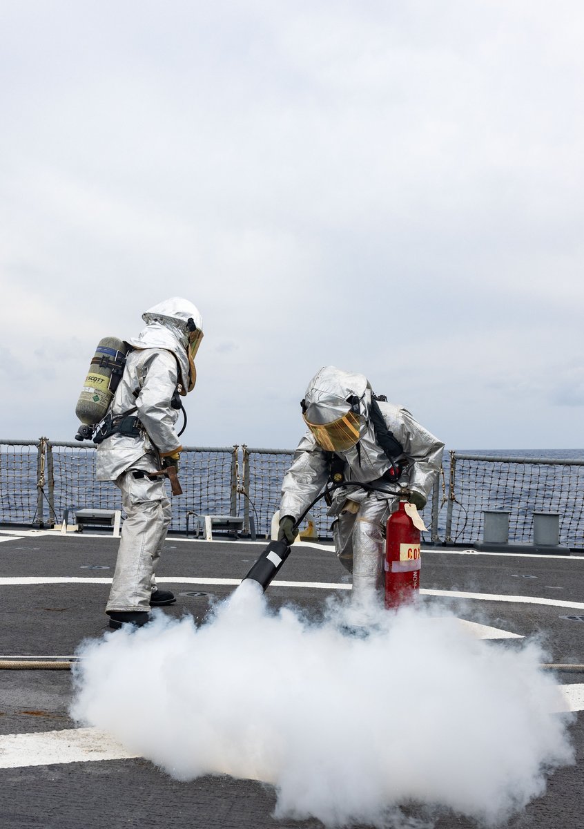 Sailors assigned to the Arleigh Burke-class guided-missile destroyer USS Higgins (DDG 76) simulate fighting a fire on the flight deck during a training scenario while operating in the Philippine Sea, May 6. #7thFleetBestFleet | #AlwaysReady