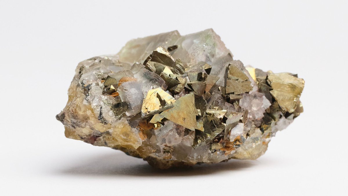 Chalcopyrite is probably the most important and major source of copper, and the most abundant copper ore. This on is beautiful with brassy chalcopyrite crystals and fluorite cubes that look almost regal. It is likely to be from the Carn Brea area. #MineralMonday