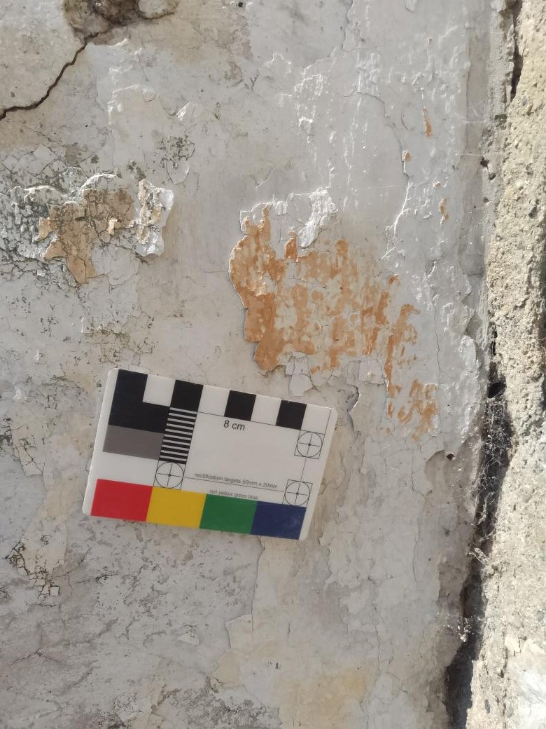 Tadcaster, original flat finished lime render and wash.  These walls appear to be boundary walls either side of a public footpath. The image on brick work is a gable end of a dwelling. Some work appears to have  ruling marks some not.