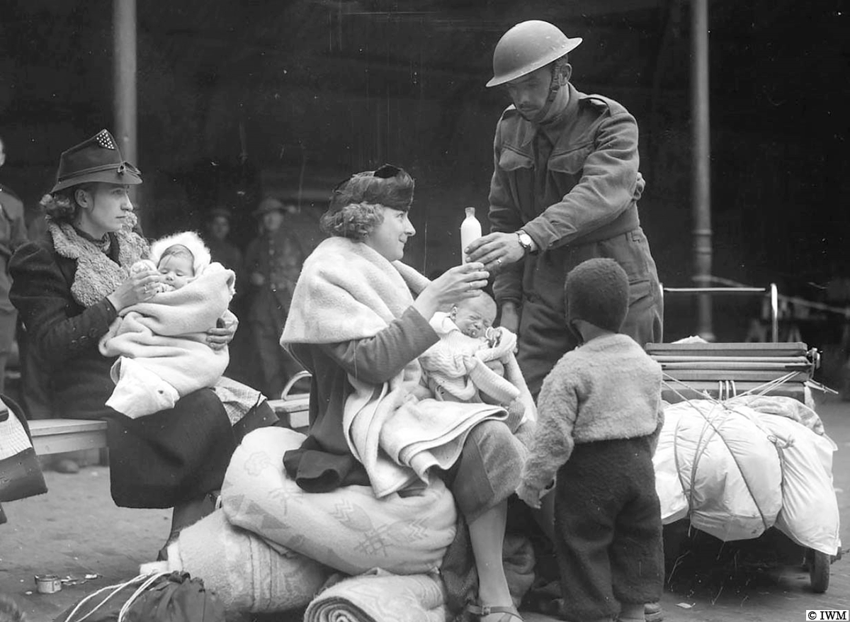 #OTD in 1940, Belgium. A British soldier providing milk for a Belgian family near Louvain. #WW2 #HISTORY
