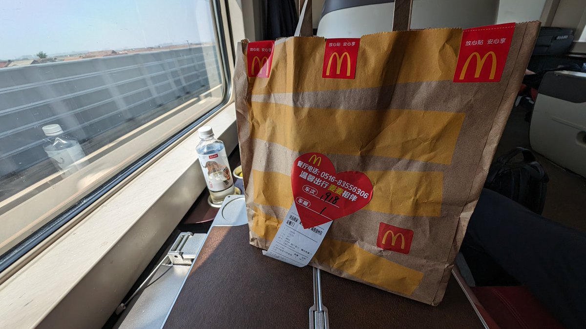 So something very unique about the long distance trains in China - you can order food from restaurants in the stations along the way and they'll deliver it to the platform, when the train stops the attendants will take it and bring it to your seat.