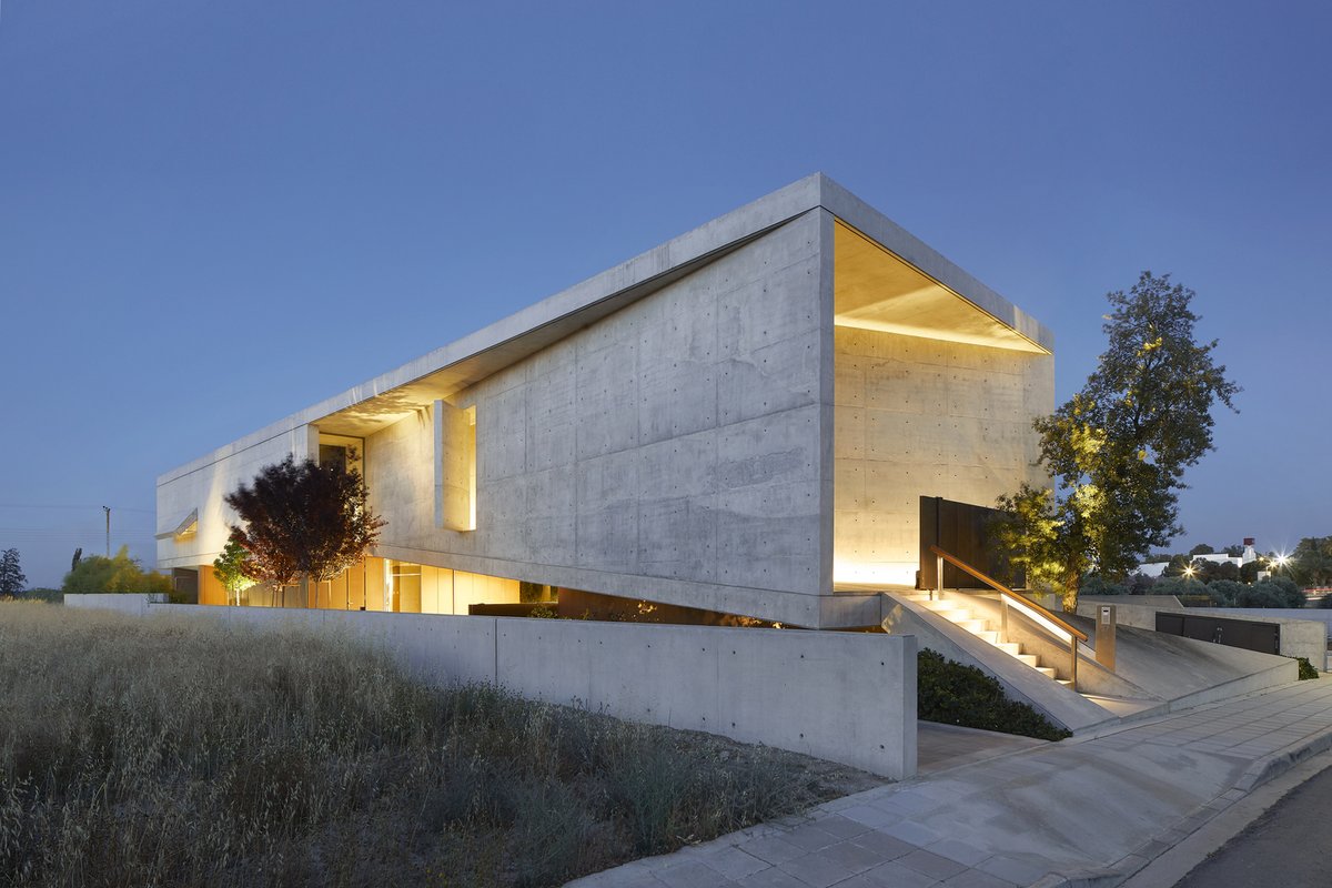 #Residence 222 is designed in a way that one cannot read the domestic function behind the monolithic #concrete structure. The northwest façade is cut out and folded out, forming protective and directional shields to the openings. ow.ly/56qN50RE2Nv #architecture