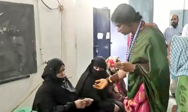 Madhavi Latha asks burqa-clad Muslim women at a polling booth to reveal their faces so that she can match them with the photographs on their voter ID cards. Madhavi Latha - I am a candidate. As per law, a candidate has the right to check ID cards without facemasks.