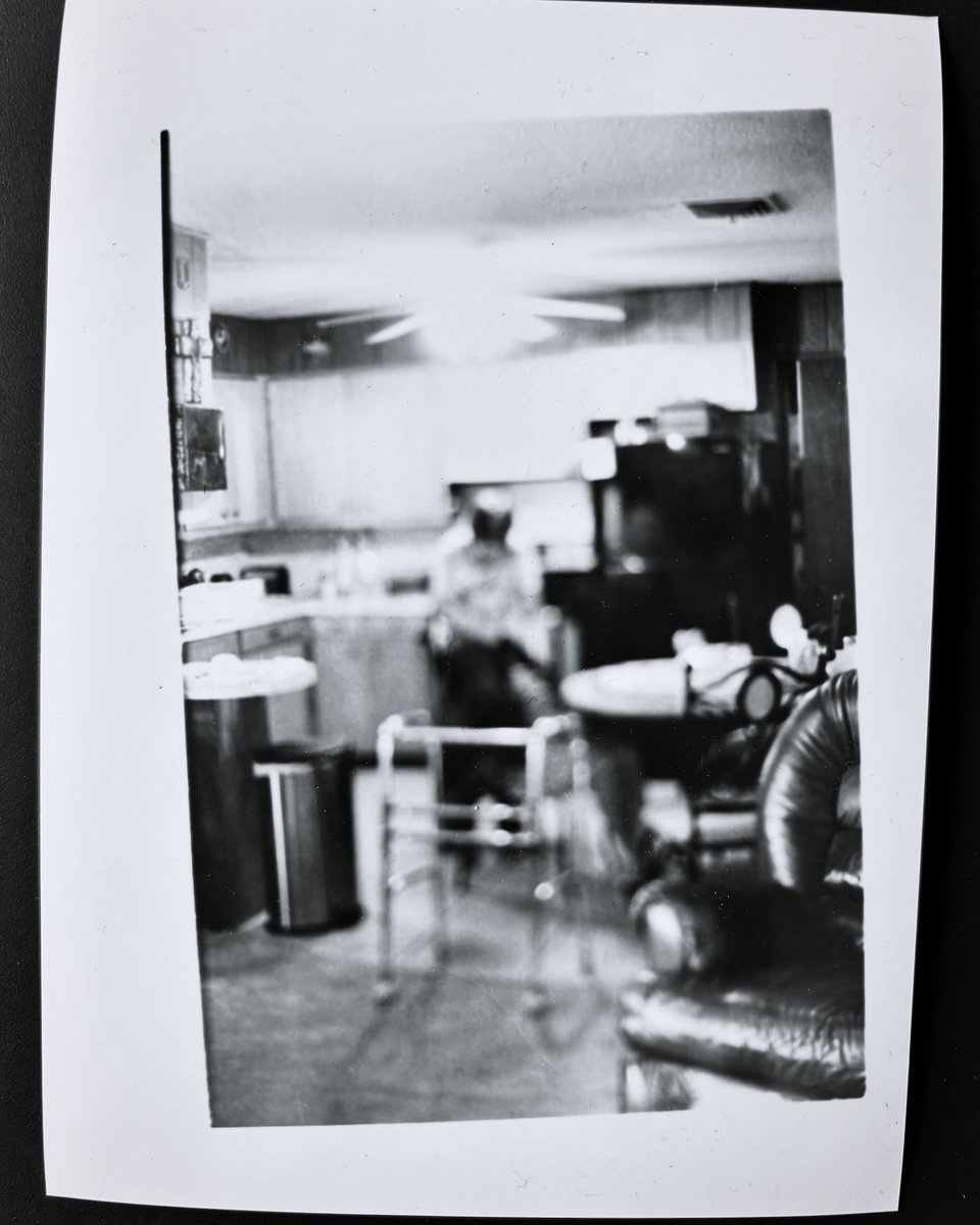 I use #photography to help document my journal. This #bnw #photograph is of my mom in her kitchen. I use #film and I developed in my #darkroom.