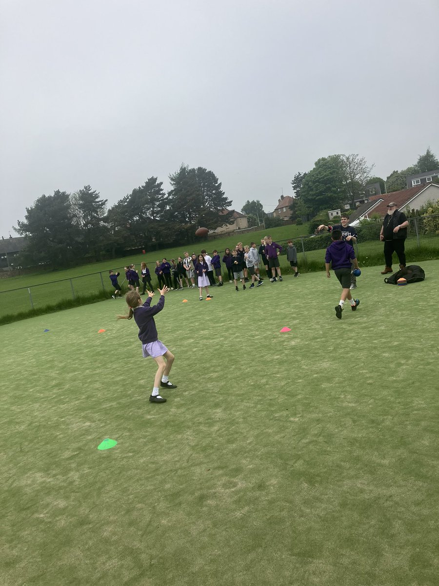 P5B enjoyed their second session of American football today. They practised catching and even got try in some equipment.