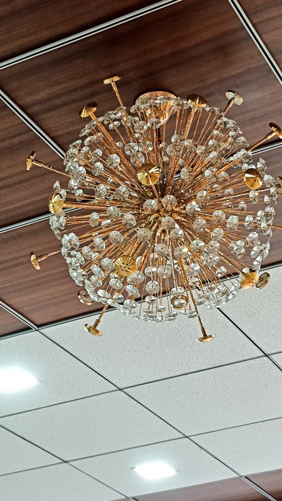 This Chandelier in the healthcare clinic is looking like corona virus😐😐