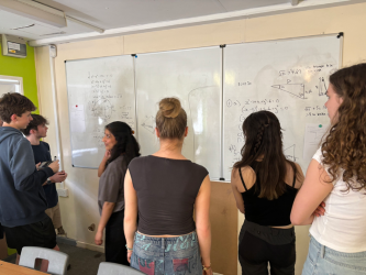 HighdownSchool's tweet photo. When Rachel Cave, Headteacher, visited a Year 13 maths lesson last week, she saw their "working wall" in action. Engagement, problem solving and the highest level thinking skills were in evidence! https://t.co/juScWB9lgv