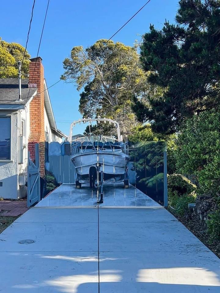 California resident Etienne Constable who kept his boat beside his house was ordered by the city to put up a fence to hide the boat from view. 

So he built the fence and hired someone to paint it. 💁‍♂️