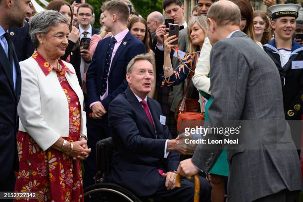 British journalist Frank Gardner shakes hands with Prince Edward, Duke of Edinburgh as Gold Award recipients of the Duke of Edinburgh award attend a garden party at Buckingham Palace on May 13, 2024 in London, England. (Photo by Leon Neal/Getty Images)