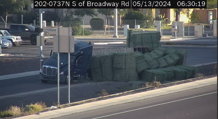 TRAFFIC ALERT Hay.. that's a precarious situation. Driver lost load off the flat bed semi, blocking SB Loop 202 (S Mt) on ramp @ Broadway. #azfamily