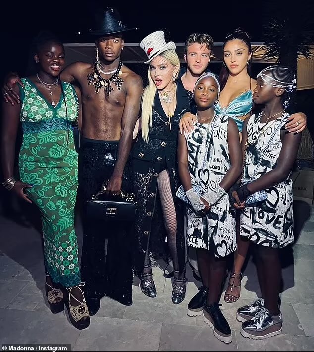Madonna has purchased most her family……. The kids look like props…..
