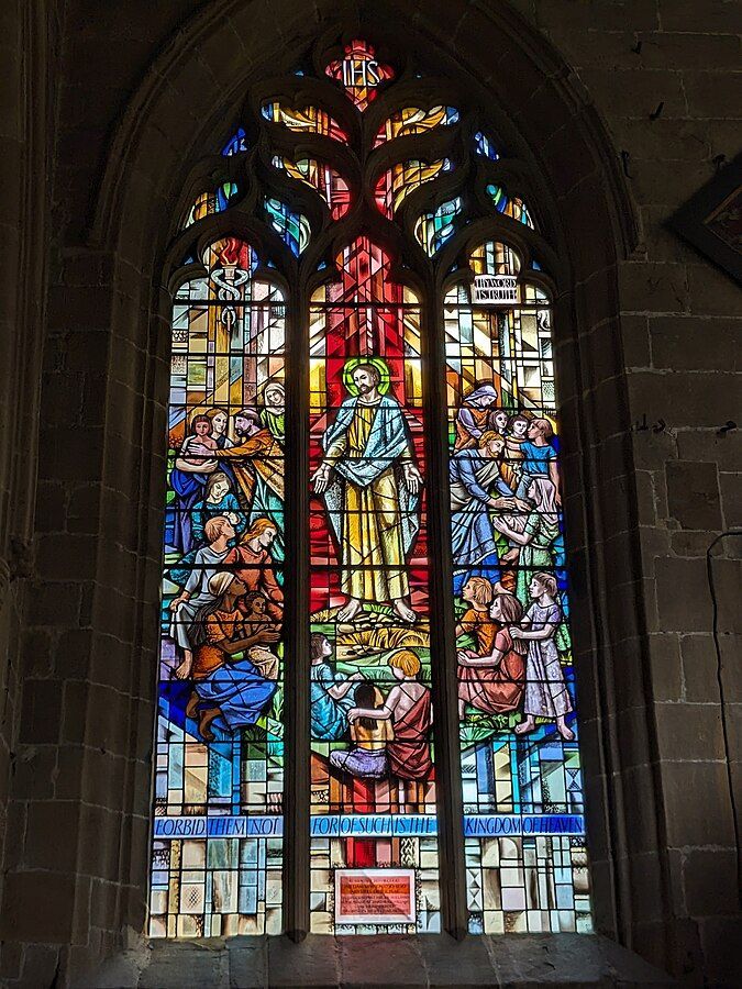 Stained-glass window in St John the Baptist Church of England church in Tideswell, UK. Credit - Michael Rowe, CC BY-SA 4.0 <creativecommons.org/licenses/by-sa…>, via Wikimedia Commons