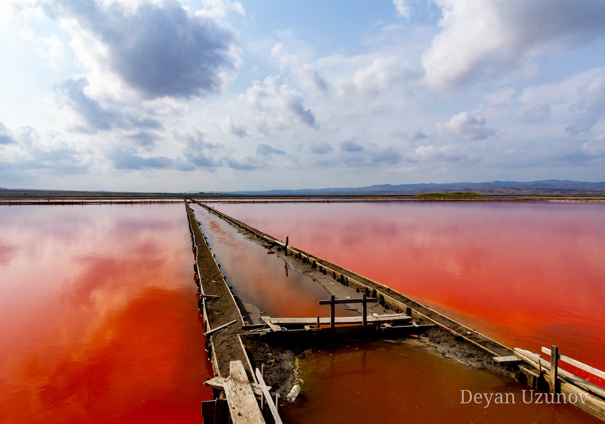 Atanasovsko Lake's Surreal Beauty Behold the breathtaking allure of Atanasovsko Lake, where nature paints with vivid hues that defy imagination! Nestled near Burgas, Bulgaria, this hidden gem boasts a surreal landscape that captivates the senses and ignites the soul.