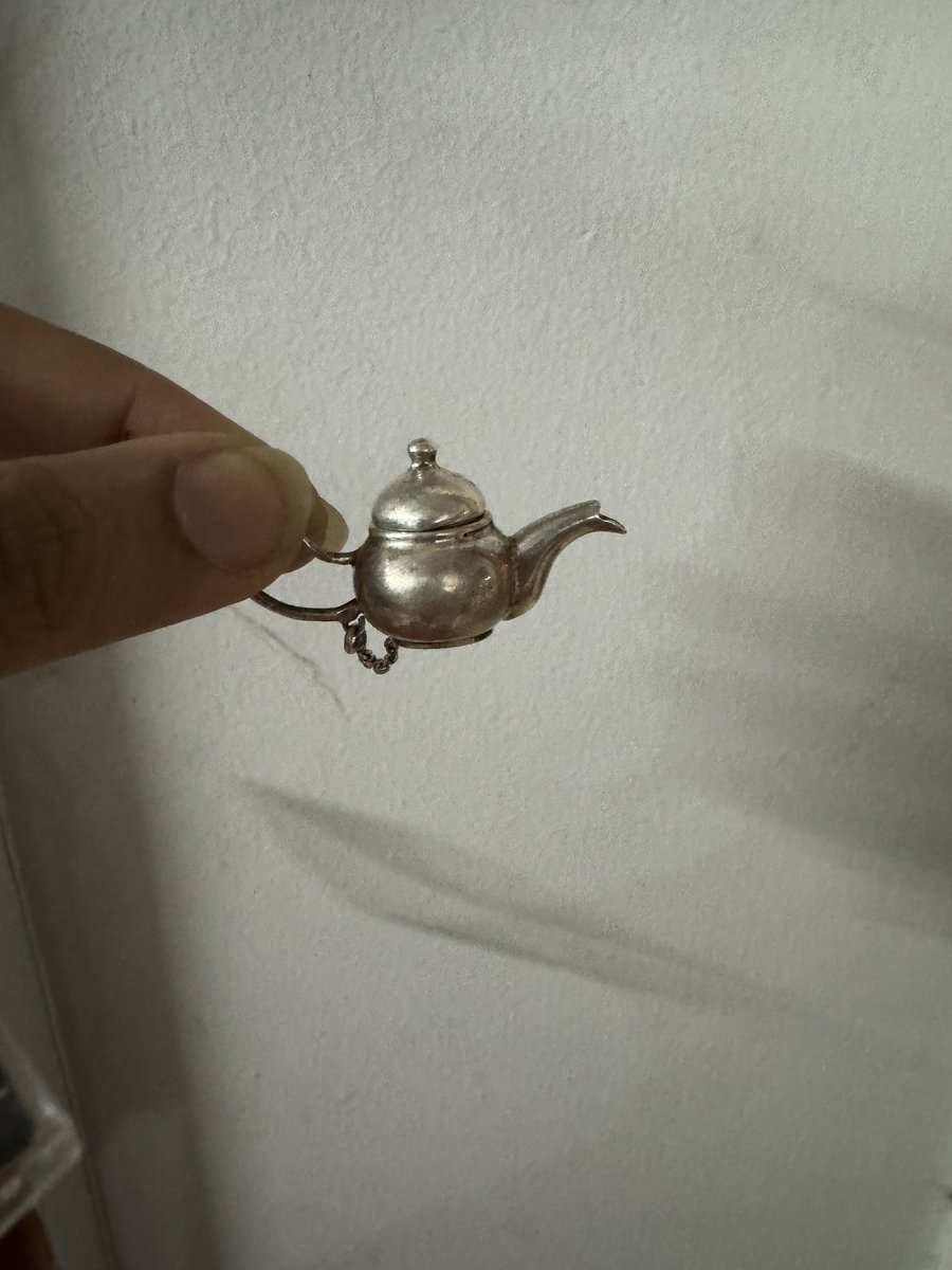 Behold! A tiny metal teapot that works