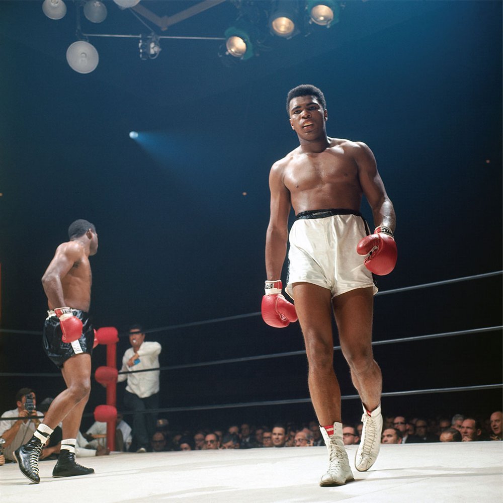 Muhammad Ali walking to the corner during his fight vs Floyd Patterson at the Las Vegas Convention Center. 

November 1965.

📸: @LeiferNeil 

#MuhammadAli #Icon #NeilLeifer #Photographer #HistoricBouts #BoxingLegends #CapturedMoments