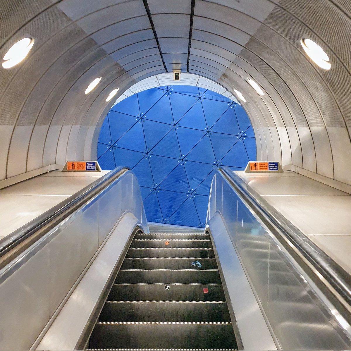 Southwark Underground. Escalator leading up to the spectacular blue glass wall on the upper concourse #BlueMonday @TfL #lifeinlondon #londonunderground