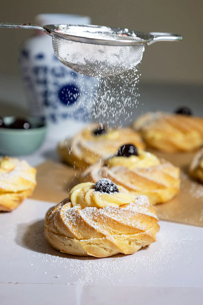 In Italy, Father's Day is celebrated with this fried pastries filled with pastry cream and topped with Amarena cherries, called Zeppole di San Giuseppe. This at-home version is easier and has a lighter and airier texture. Get the recipe-thegiadzy.visitlink.me/l_cAGV