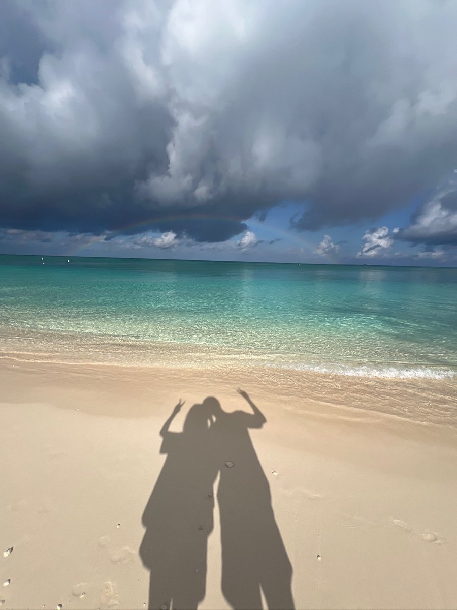 Catching sun rays and kissing stingrays. Only in Grand Cayman 🇰🇾