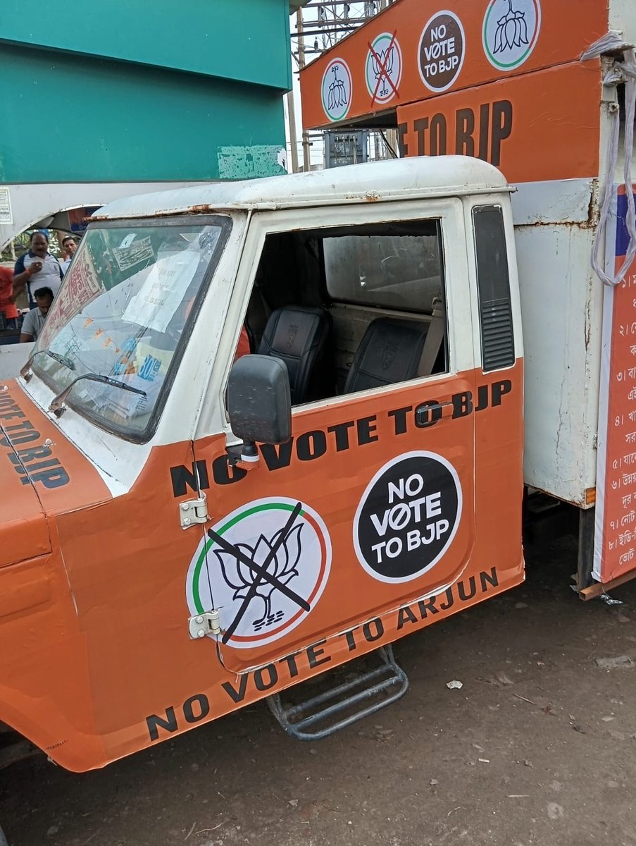 ArjunsinghWB's tweet photo. Today, @BJP4Bengal workers stopped a vehicle which had banners ‘NO VOTE TO BJP’, ‘NO VOTE TO ARJUN’ around it and handed it over to the local police in Bijpur assembly area. Many objectionable/abusive words were being used through loudspeakers fixed on the said vehicle. 

Does this vehicle receive permission from the @ECISVEEP? The registration number is clearly visible, it should be probed. 

Though it was handed over to Police but it was allegedly released in a few hours on the instructions of J.P. Pandey, ACP, Bijpur. 

Not to be surprised, the BJP workers who handed this vehicle over to Police were detained and harassed by the police. It shows the partisan role of the @bkpcitypolice.

ACP Pandey is more devoted to @AITCofficial than its own party cadres, several complaints have been lodged against him but he is still following the orders of TMC leaders rather than doing his duty impartially. 
I request @ECISVEEP to inquire into this incident and take immediate action against the said ACP. @SpokespersonECI @CEOWestBengal @BengalGovernor @DrSukantaBJP @SuvenduWB