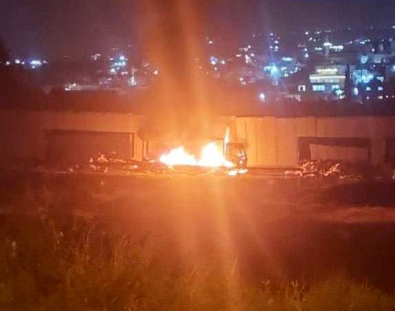 Israeli settlers near Hebron emerge from their terror outposts and set fire to aid trucks en route to Gaza.