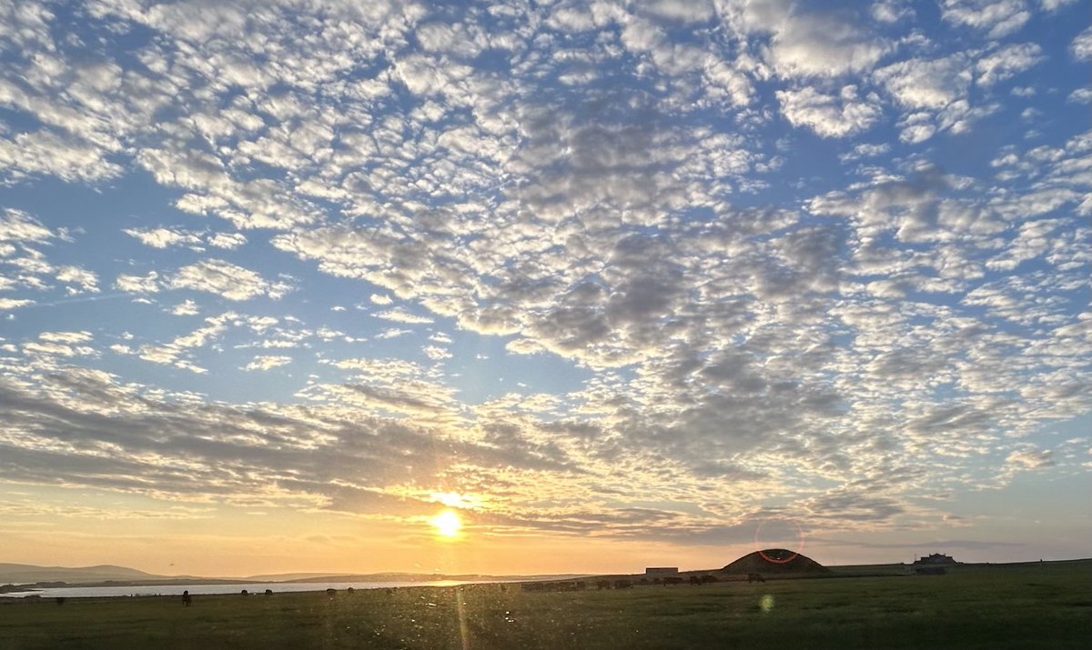 Orkney’s 5000 year old chambered cairn, Maeshowe, at sunset.