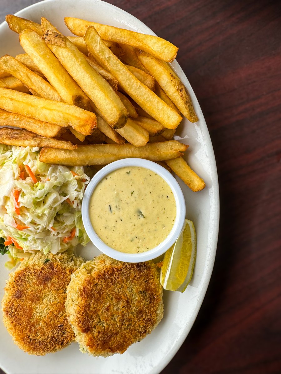 Meet your new favorite dish. Panko crusted crab cakes with French fries, coleslaw, and remoulade 🦀🍟