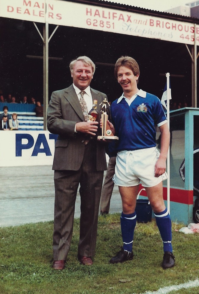 Halifax Town Player of the Year 1980/81 Paul Hendrie receives the award from visiting manager Tommy Docherty of Preston. 📷Keith Middleton.
