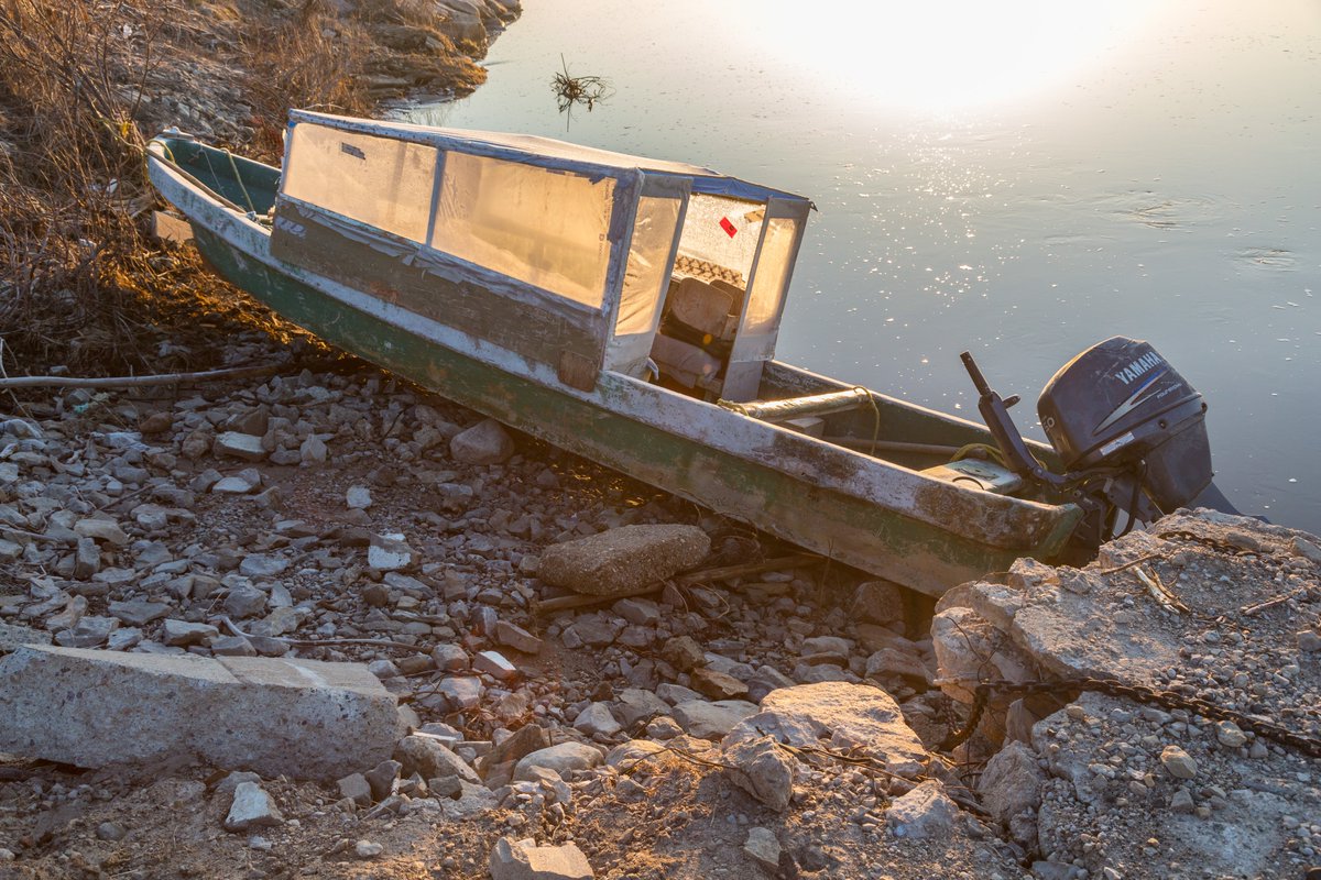 Taxi boat tied up along the Moose River. 2015 May 13.