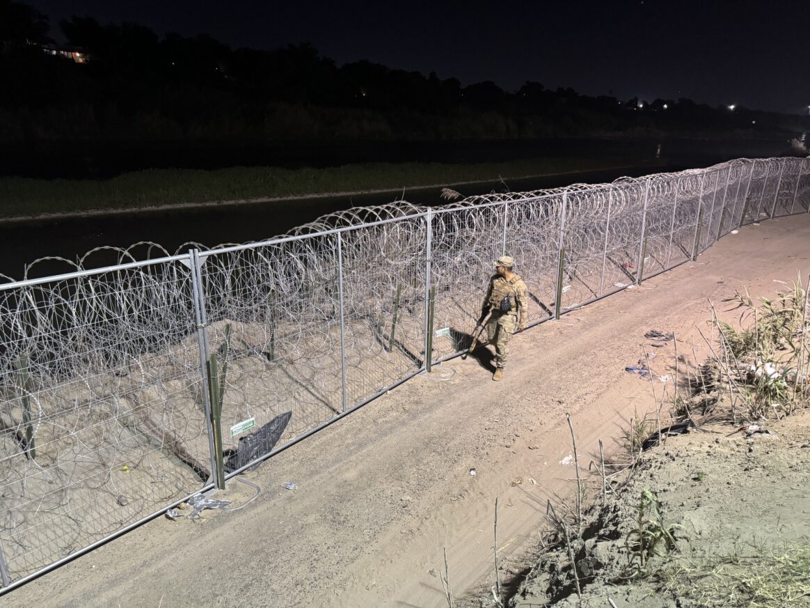 A Louisiana National Guard Soldier patrols fence at night Eagle Pass. #OperationLoneStar