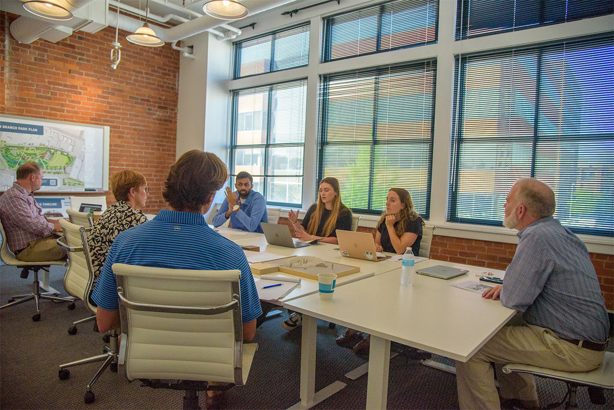 Seniors in professor Alan Bartley's Seminar in Economics capstone course recently presented a project to staff at Town Branch Park, which opens next year. The economics majors partnered on a study that will help the park's future programming meet the needs of college students.