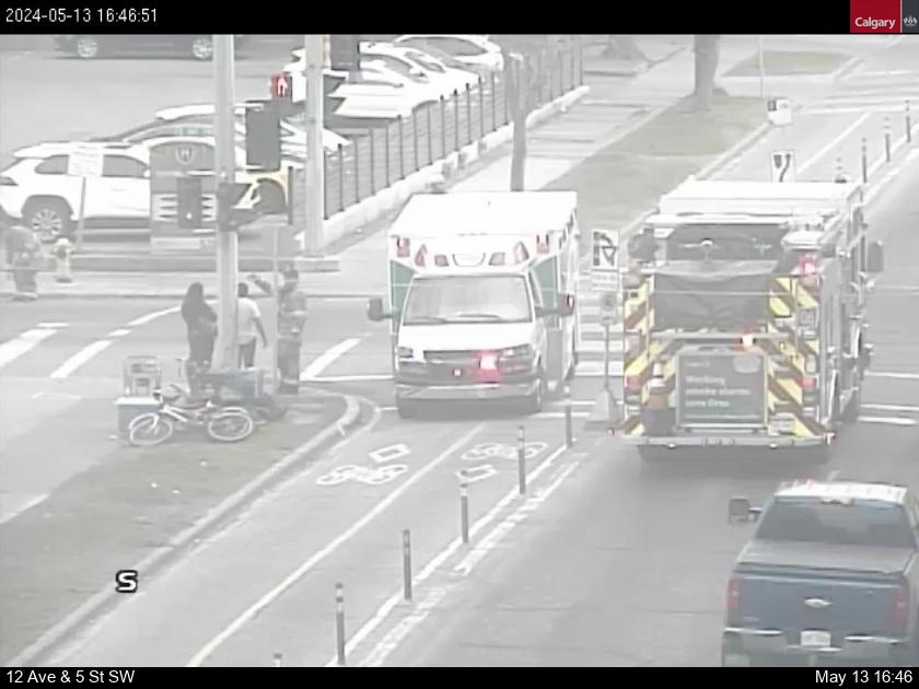 UPDATE: Emergency services are helping a cyclist involved in an incident on SB 5 St and 13 Ave SW. Blocking the left lane. Please go slow and watch for fellow Calgarians. #yyctraffic #yycroads