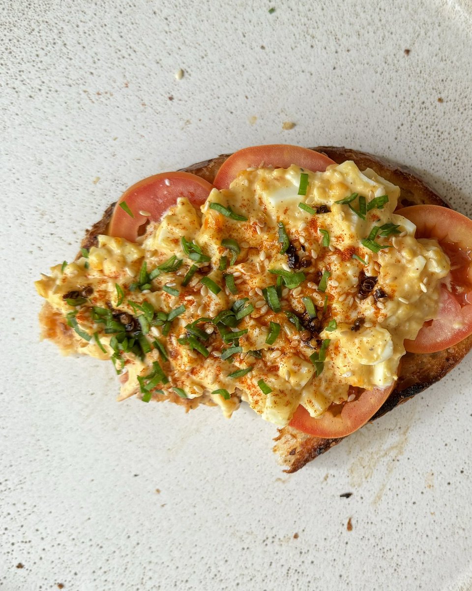 egg salad open faced sandwich with mentaiko spread, fresh tomato, sesame oil, sesame seed, Sichuan chilli oil & chives✨