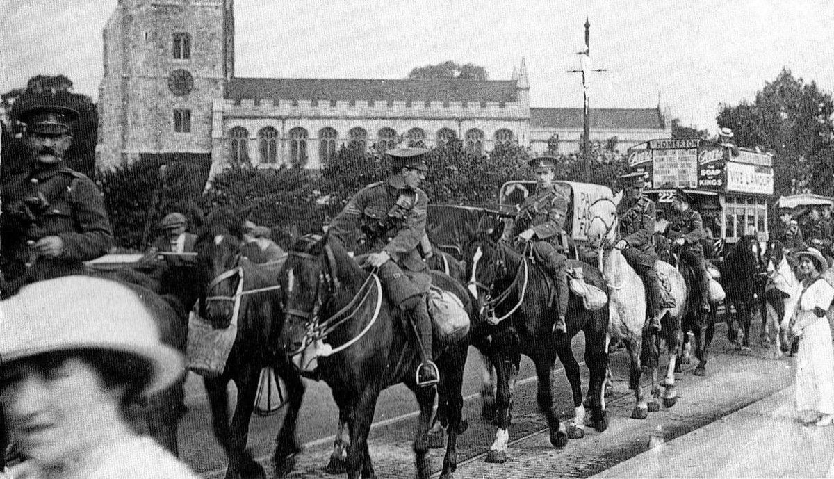 A Photograph of Troops crossing Putney Bridge in 1914 with horses commandeered from the Horse Bus Companies in Fulham.