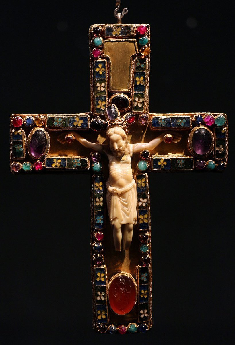 The pectoral cross of Saint Servatius, found in the Basilica of Saint Servatius, Maastricht, is made of gold and wood with cloisonné enamel plaques, a Roman gem, and precious stones. It was likely gifted by Emperor Henry III and created in Trier around 1039.