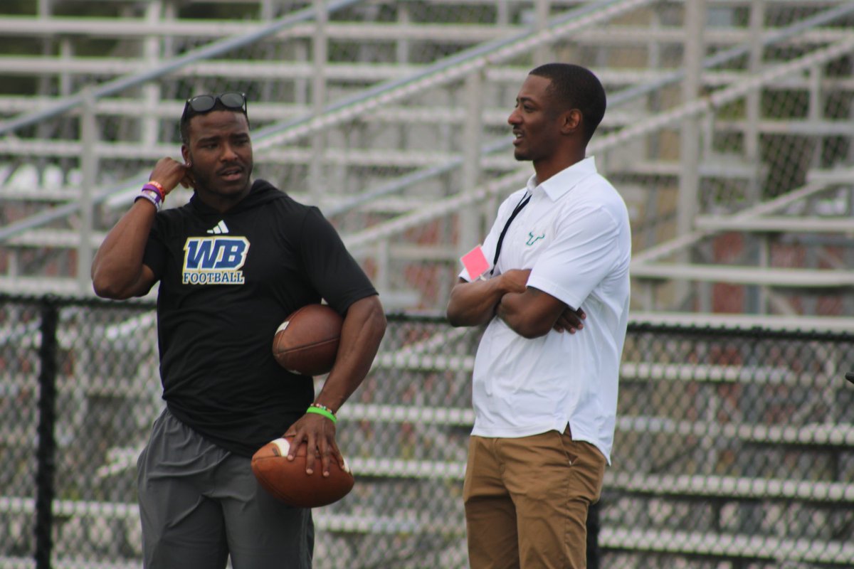 West Boca wide receiver coach and former NFL player Jacoby Ford (@JacobyFord11) chopping it up with USF cornerback coach DeMarcus Van Dyke (@Coach_DVD).