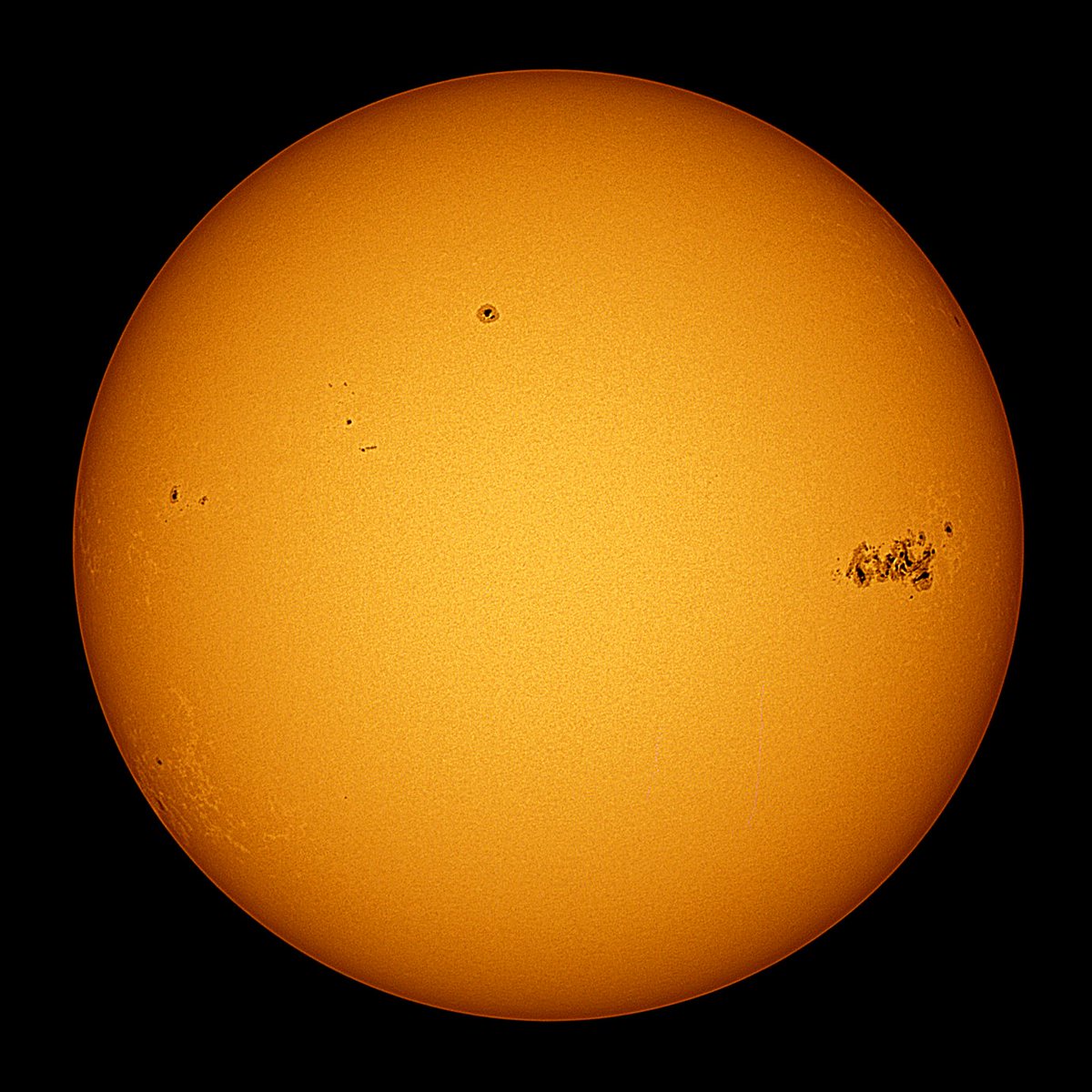Here is the Sun captured last Friday from Evanston, featuring Active Region 3664, the GIANT sunspot responsible for the auroras this weekend. The first photo is my first attempt at shooting our star in Hydrogen-alpha light, which revealed a huge solar prominence