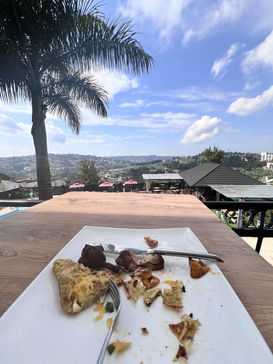 Phatill's tweet photo. One beauty is the landscape in Rwanda, called a country of a thousand hills for a reason. 

The other beautiful thing is the strategic location of Rwanda's two largest landmarks - the BK Arena and the Stade Amahoro, such that you can be enjoying breakfast on one of the hills and the golden glitters of the sports facilities in the distance.
