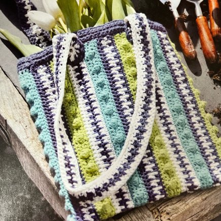 Looking For A Fun Crochet Project?

The bag is worked in a vibrant fabric featuring stripes of bright colours and textured stitches. Make long handles to wear over your shoulder or across your body #MHHSBD #craftbizparty #UKMakers

Pattern link below