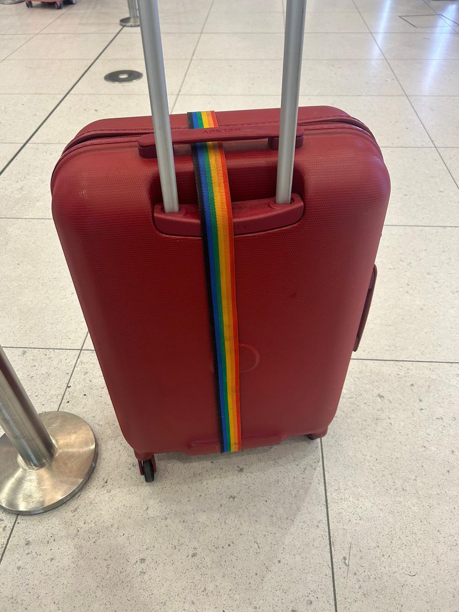 My sister went and bought this strap this morning in support of our fabulous friends 😂😂 Pulling her 'Woke Hobby Horse' suitcase through the airport #RainbowLanyard Best get Border Force onto it Esther McVey Or we'll be seen as a tolerant country and that will never do!!