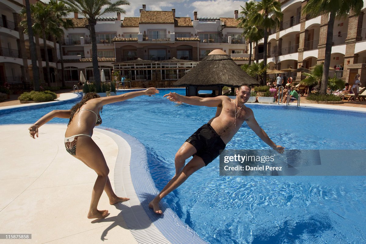 Stacey Solomon and Tyson Fury relax at the pool during the Max Clifford's Celebrity Golf Challenge Fund-Raising Weekend at La Cala Resort in Mijas, Spain. (2011)