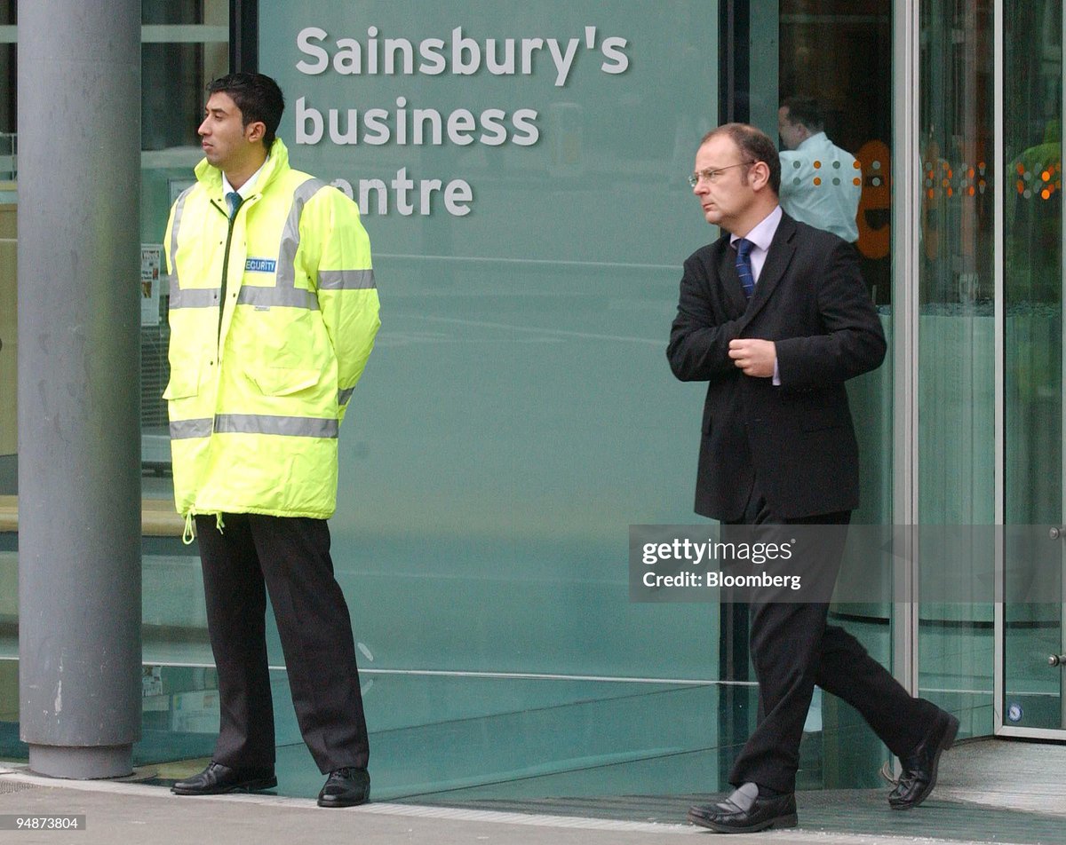 An unidentified man leaves the Sainsbury headquarters in central London (2004)